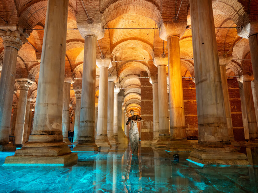 Interior view of the Basilica Cistern in Istanbul, Turkey. Ancient columns, water, illumination